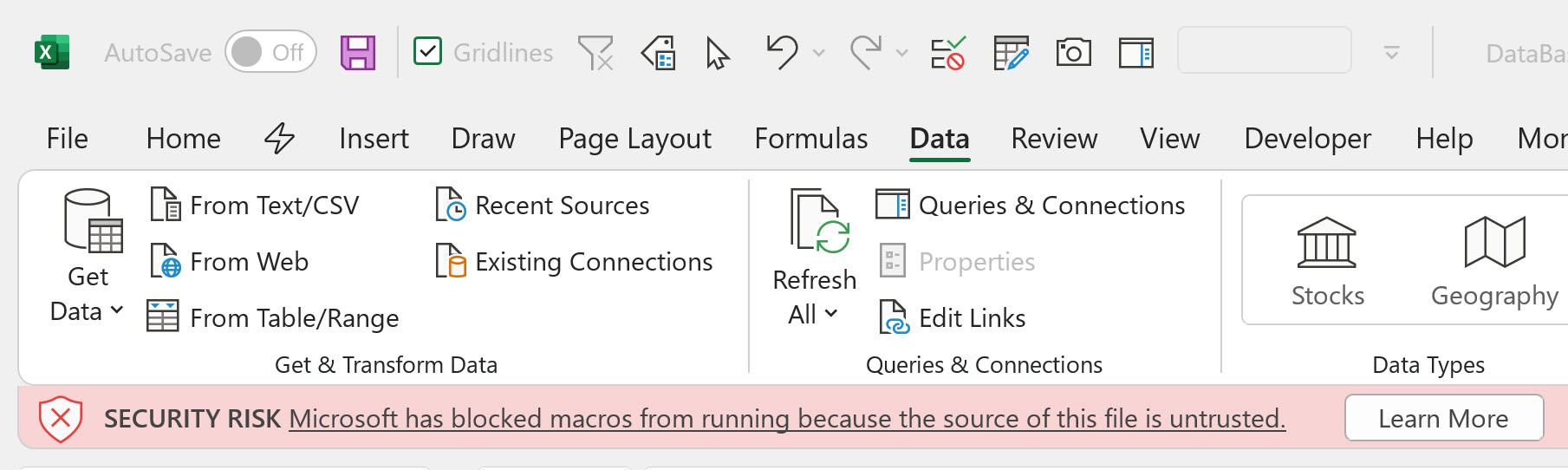 Red alert message when opening a file from the internet with macros and button to learn how to unlock VBA macros